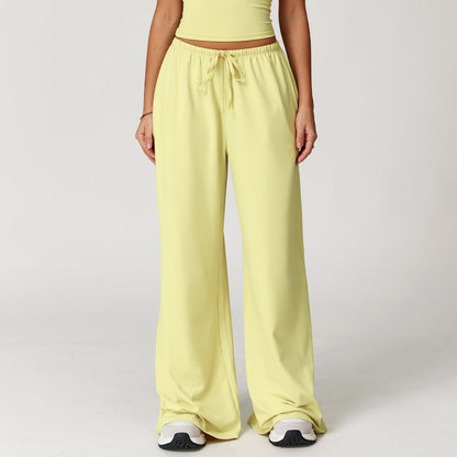 Wide women's pants made of brushed leather with high waist and pendant