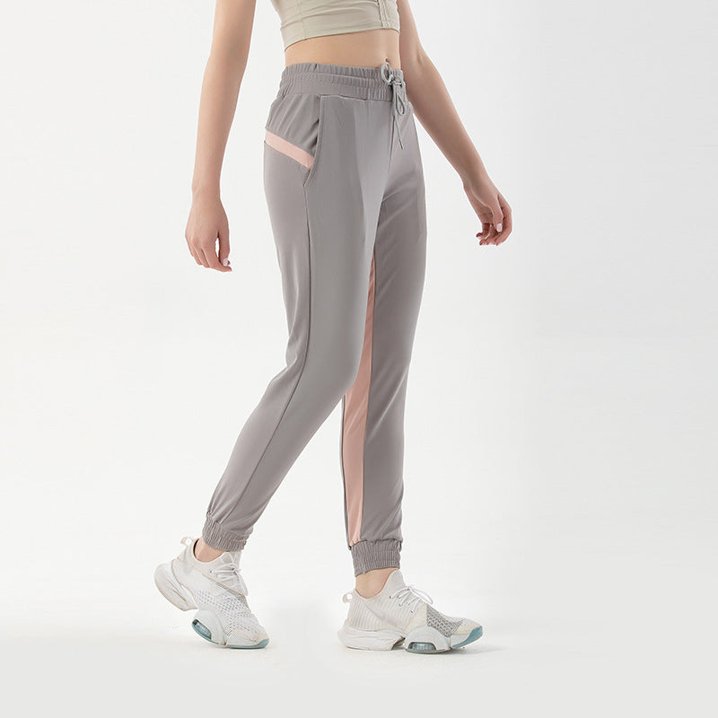 Women's sports trousers with contrasting inserts and quick-drying design