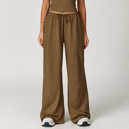 Wide women's pants made of brushed leather with high waist and pendant