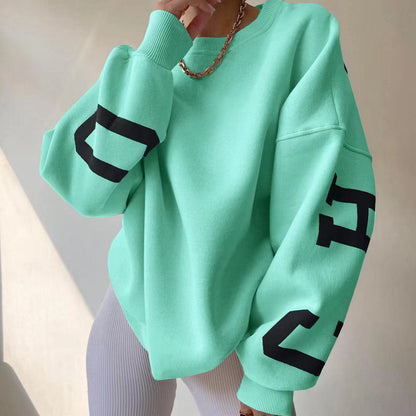 Women's top with print, round neckline, and long sleeves, loose fit