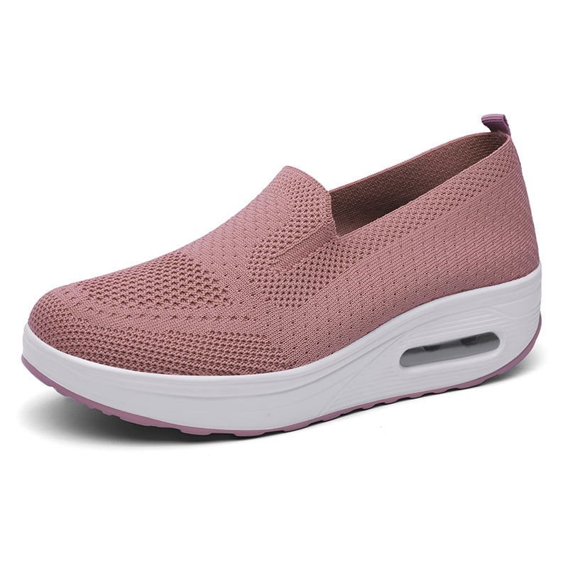 Rosa Damen-Sneaker mit atmungsaktivem Mesh-Obermaterial und weißer Sohle. Bequeme, modische Schuhe für Alltag und Freizeit.