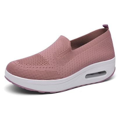 Rosa Damen-Sneaker mit atmungsaktivem Mesh-Obermaterial und weißer Sohle. Bequeme, modische Schuhe für Alltag und Freizeit.