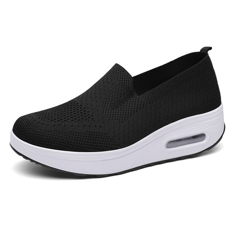 Schwarzer Damen-Sneaker mit weißer Sohle, atmungsaktivem Mesh-Obermaterial und erhöhtem Absatz. Bequeme Freizeitschuhe für Alltag und Sport.