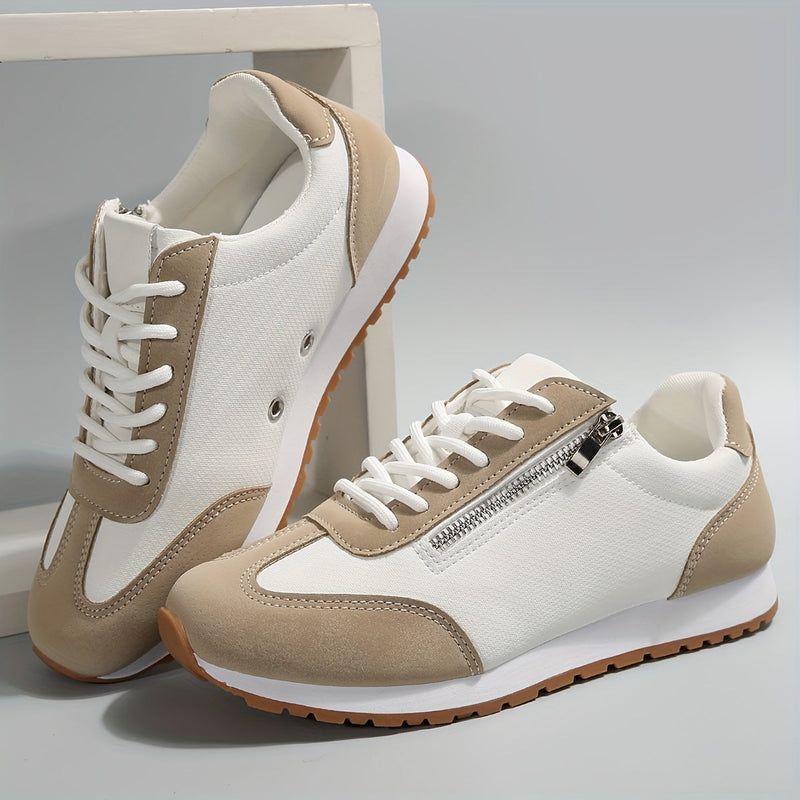 Weiße und beige Sneaker mit Reißverschluss und Schnürsenkeln, sportliches Design, rutschfeste Sohle, ideal für Freizeit und Sport.