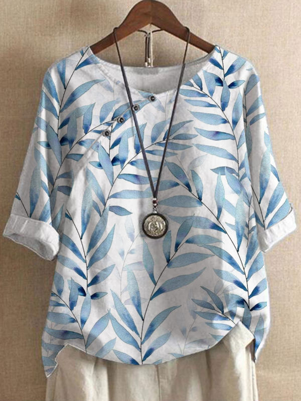 Damenbluse mit blauem Blattmuster, lässiger Stil, Rundhalsausschnitt, Knopfleiste, lange Ärmel, ideal für Frühling und Sommermode.