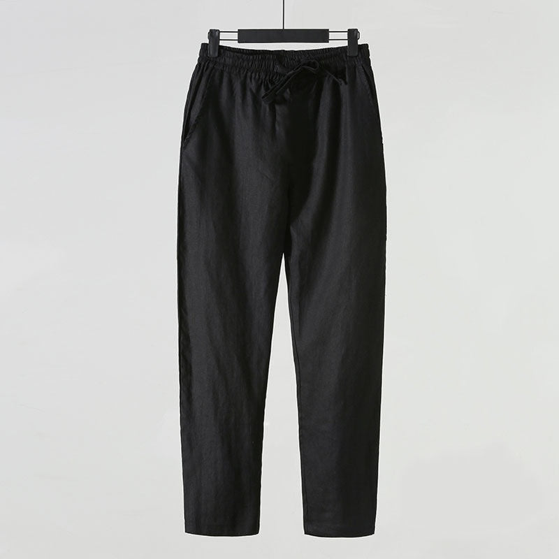 Schwarze Leinenhose für Herren, lässiger Stil, elastischer Bund, Kordelzug, seitliche Taschen, ideal für Sommermode und Freizeitkleidung.