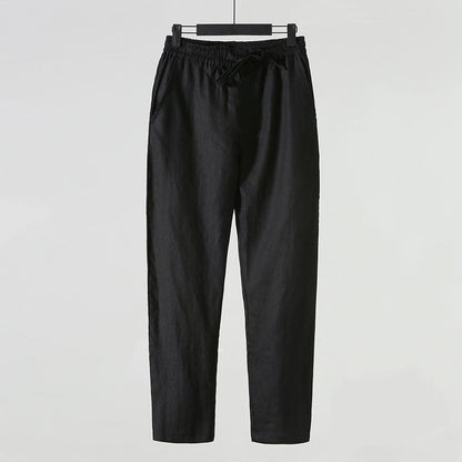 Schwarze Leinenhose für Herren, lässiger Stil, elastischer Bund, Kordelzug, seitliche Taschen, ideal für Sommermode und Freizeitkleidung.
