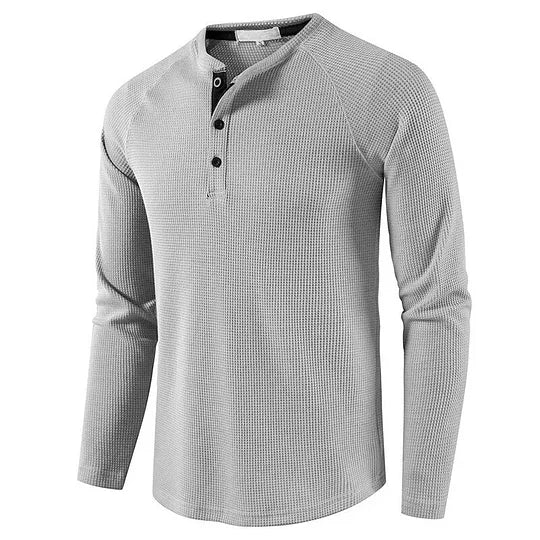 Graues Herren-Henley-Shirt mit langen Ärmeln und Knopfleiste, aus Baumwollmischung. Ideal für Freizeitmode und lässige Outfits.
