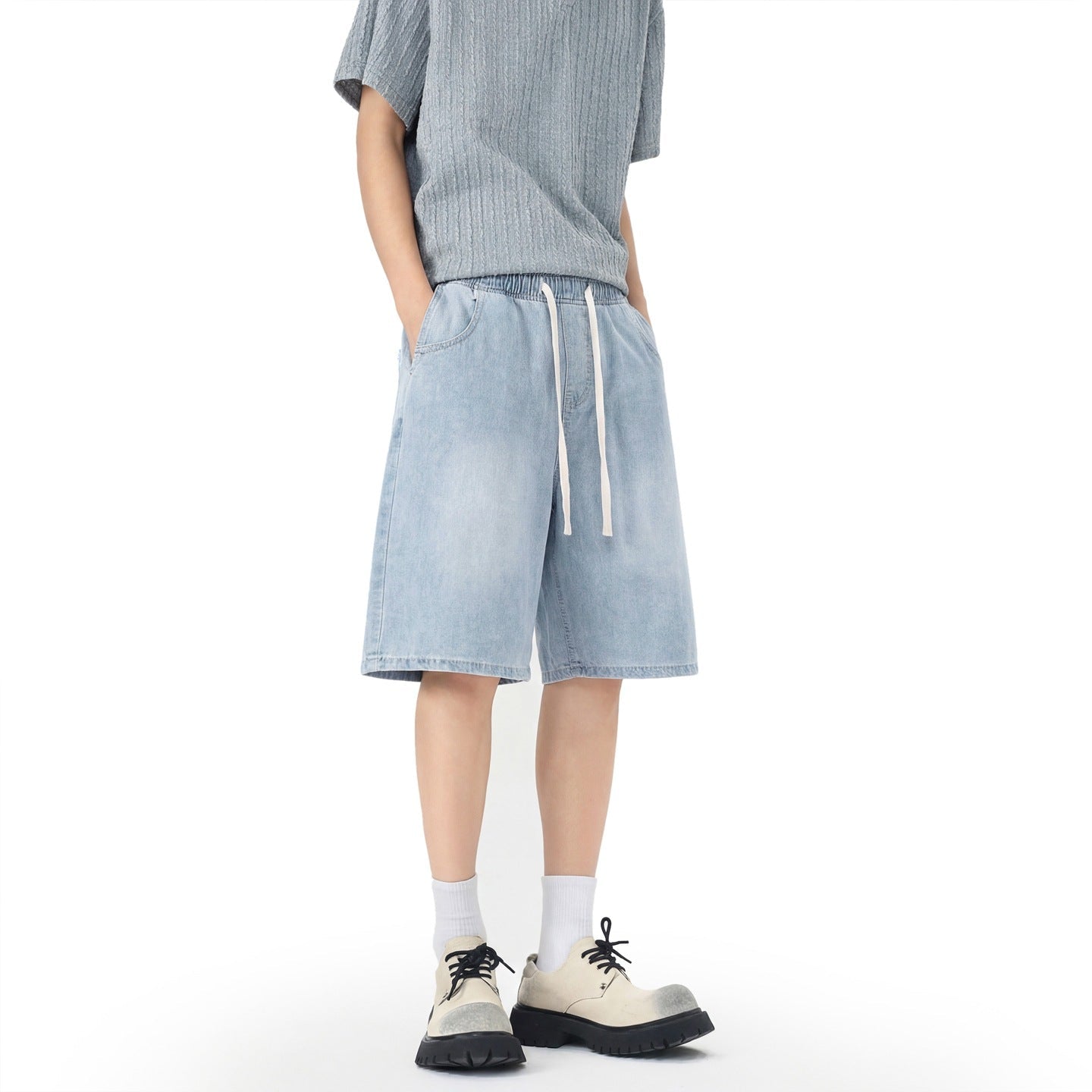 Men's denim shorts with stretch waistband, straight leg, and shortened fit