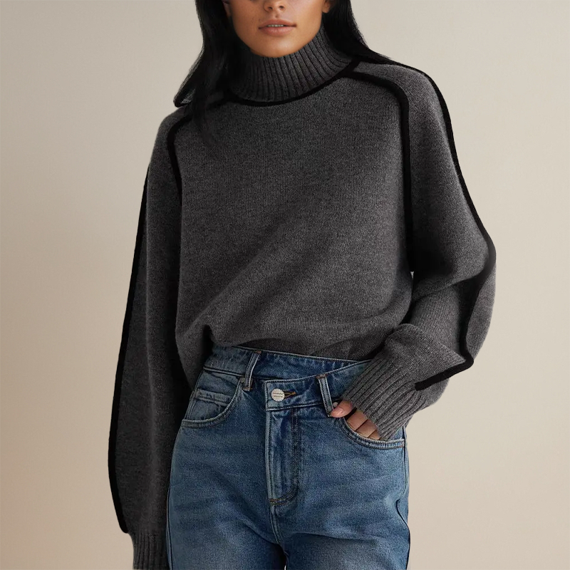 Frau in grauem Rollkragenpullover und blauer Jeans, modischer Herbstlook, gemütlicher Strick, lässiger Stil, Damenmode, trendige Kleidung.