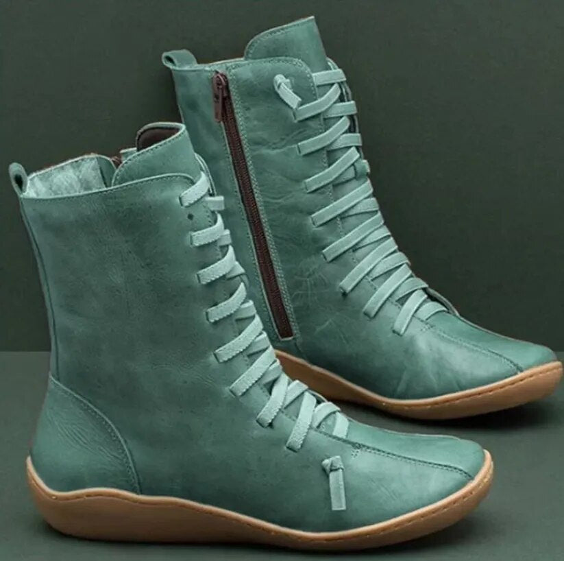 Grüne Damenstiefel aus Leder mit Schnürung und seitlichem Reißverschluss, flache Sohle, modisch, bequem, ideal für Herbst und Winter.