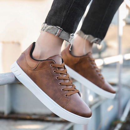 Men's lace-up shoes with low shaft, round toe area, and rubber sole