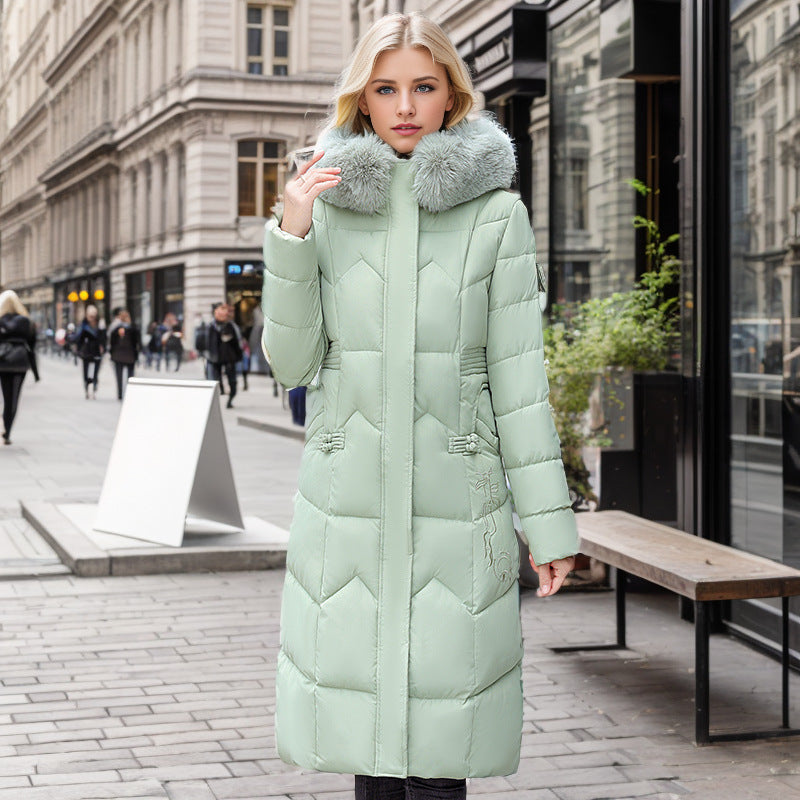 Women's long winter coat with faux fur collar and quilted design