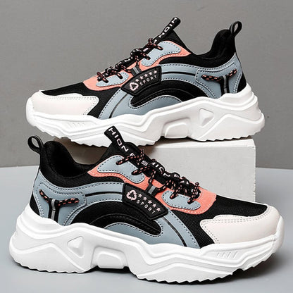 Graue und rosa Damen-Sneaker mit dicker weißer Sohle, sportliches Design, ideal für Freizeit und Fitness, modische Turnschuhe für Damen.