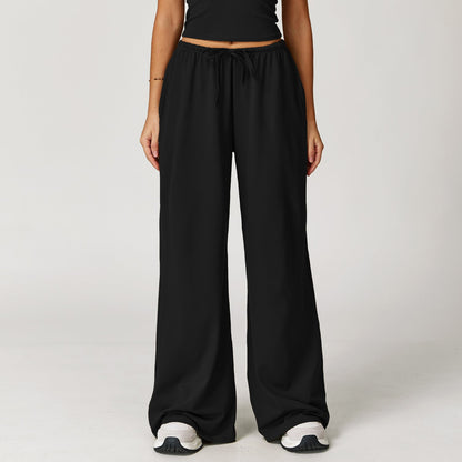 Wide women's pants made of brushed leather with high waist and pendant