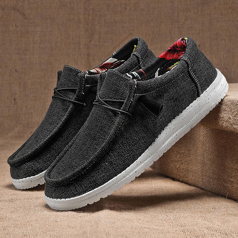 Graue Herren-Sneaker aus Leinen mit weißer Sohle, lässiges Design, ideal für Freizeit und Alltag, komfortabel und stilvoll.