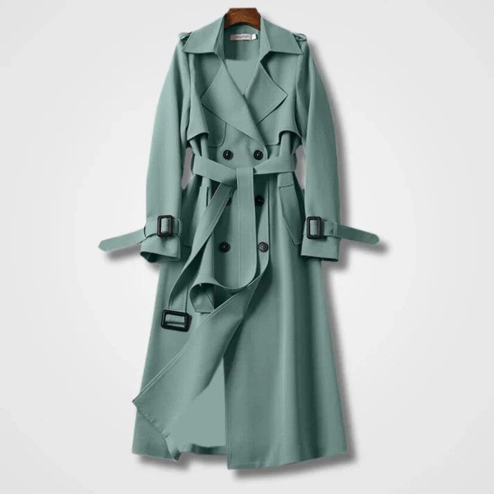 Eleganter mintgrüner Trenchcoat mit Gürtel, doppelreihigem Knopfverschluss und Schulterklappen. Modischer Damenmantel für Herbst und Frühling.