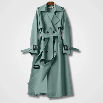 Eleganter mintgrüner Trenchcoat mit Gürtel, doppelreihigem Knopfverschluss und Schulterklappen. Modischer Damenmantel für Herbst und Frühling.