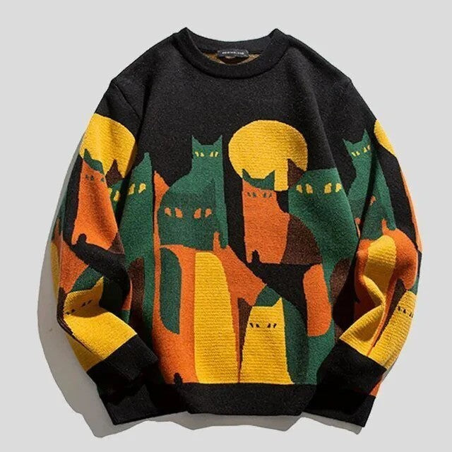 Bunter Pullover mit Katzenmotiv, Herbstfarben, Mond im Hintergrund. Modischer Strickpullover, ideal für kühle Tage. Katzenliebhaber Mode.