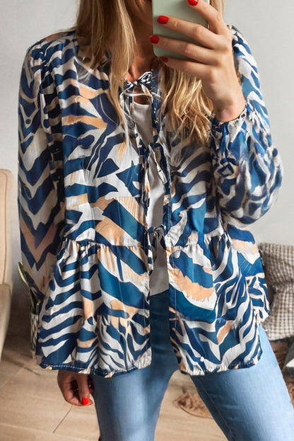 Women's blouse with puff sleeves and blue zebra pattern