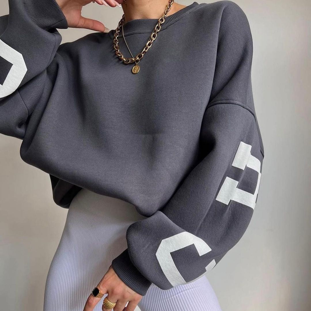 Women's top with print, round neckline, and long sleeves, loose fit