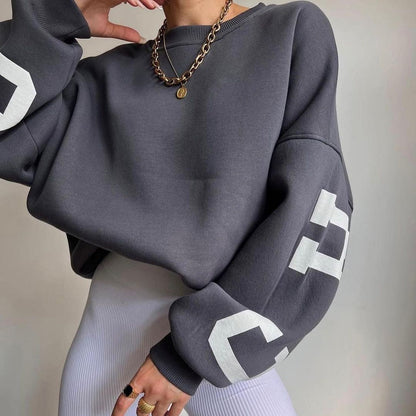 Women's top with print, round neckline, and long sleeves, loose fit