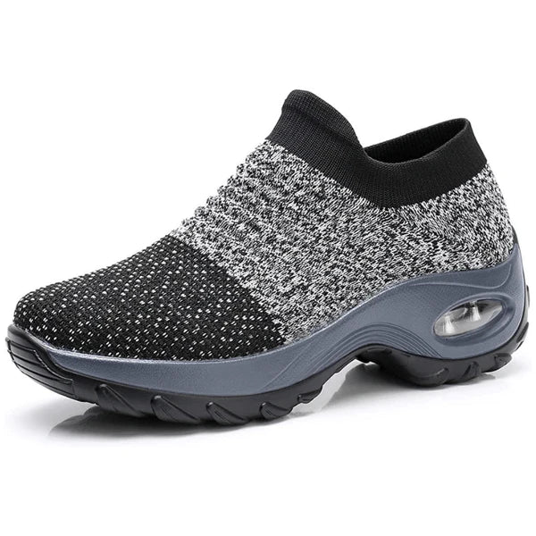 Schwarzer und grauer Damen-Sneaker mit rutschfester Sohle, atmungsaktivem Strickmaterial und gepolsterter Ferse für optimalen Komfort.