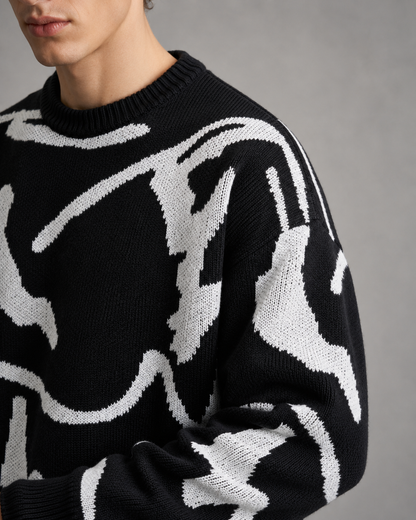 Detailansicht des abstrakten Grafikmusters auf dem Strickpullover