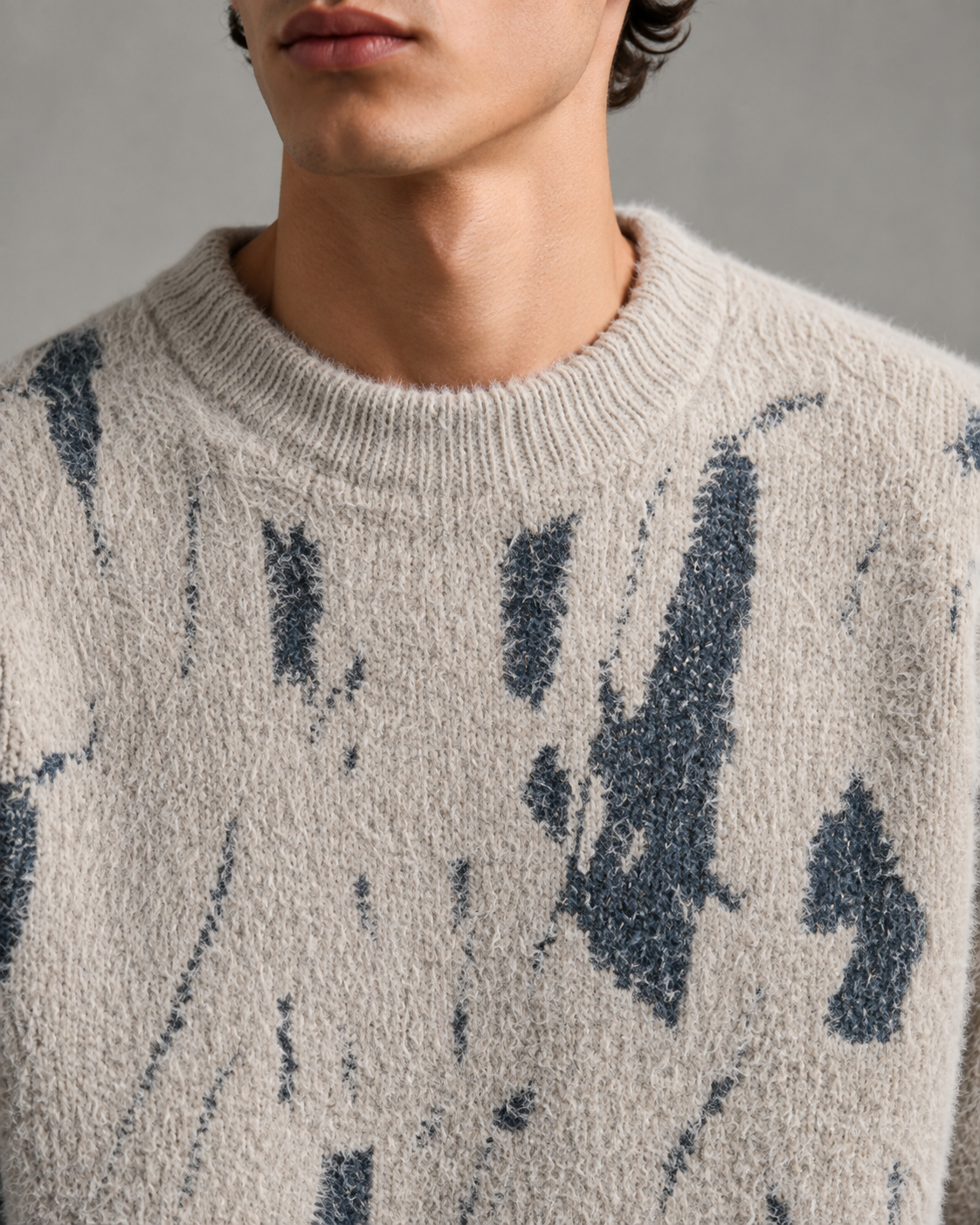 Nahaufnahme des abstrakten Musters auf dem Strickpullover