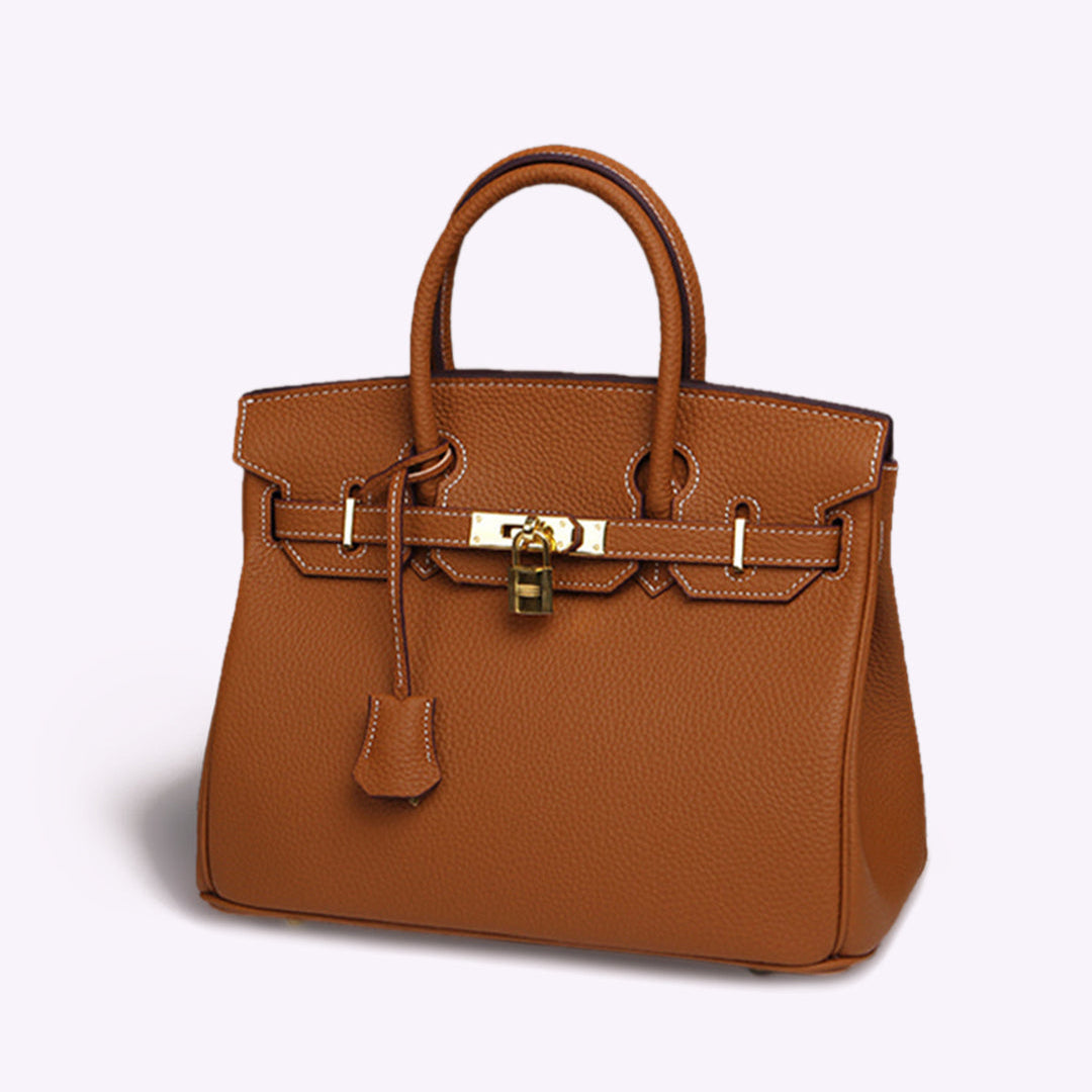 Luxuriöse braune Lederhandtasche mit goldener Schnalle und Henkeln, stilvolles Design, ideal für Damenmode und Accessoires.