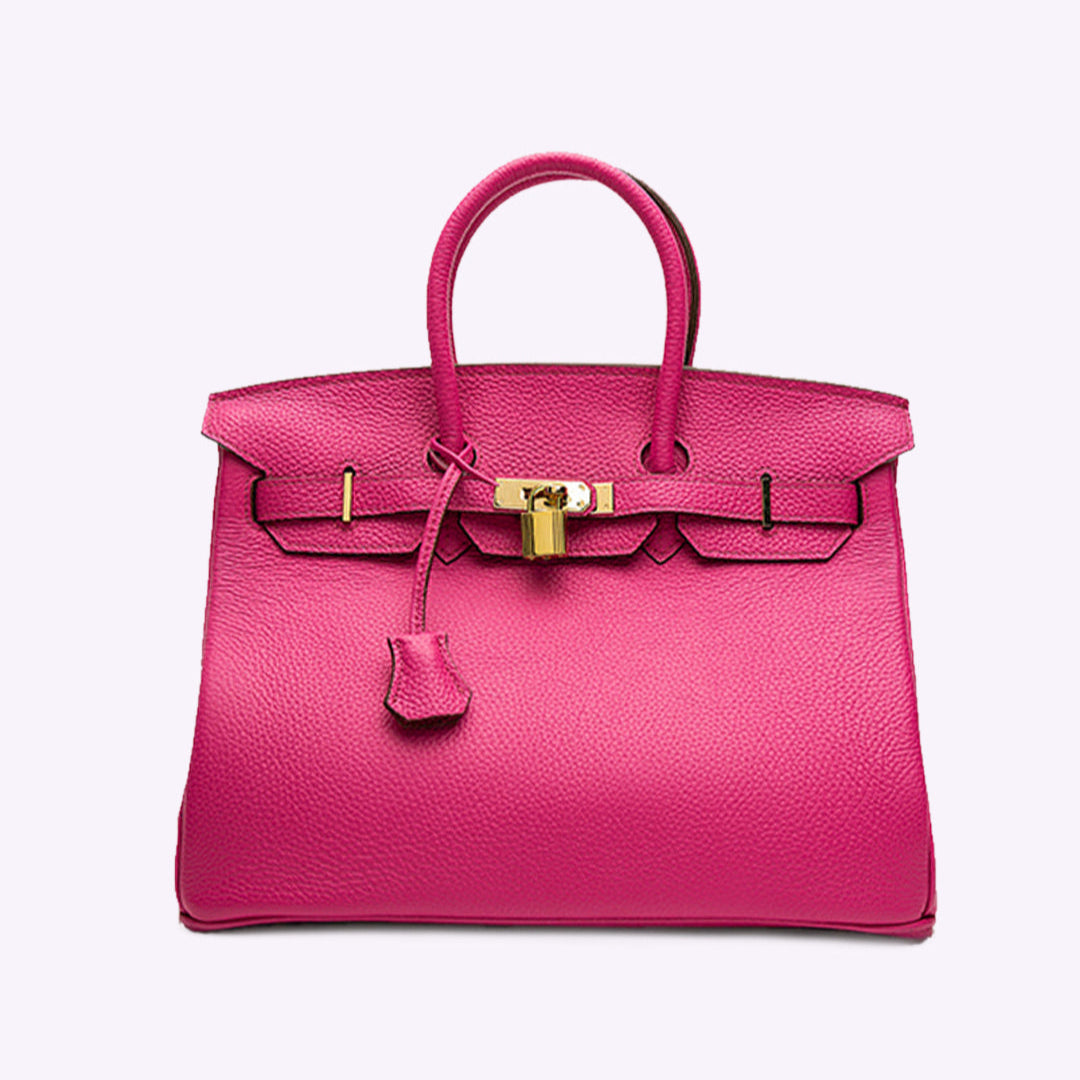 Luxuriöse pinke Lederhandtasche mit goldener Schnalle, elegantes Design, modisches Accessoire, ideal für stilvolle Damen.
