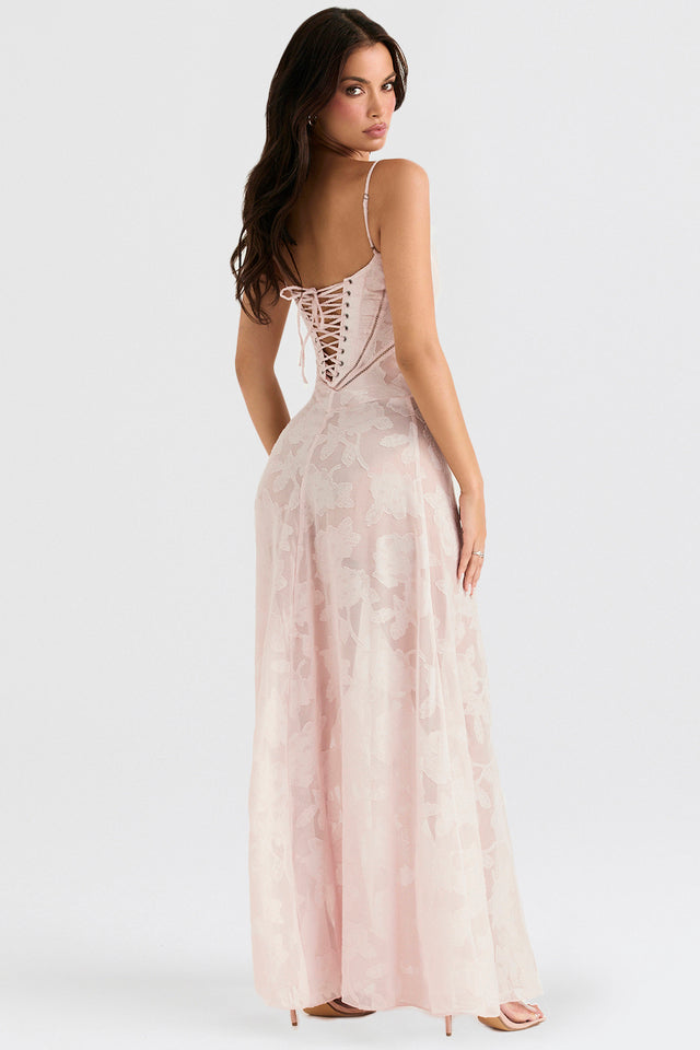 Frau in rosa Abendkleid mit Schnürung, florales Muster, Spaghettiträger, elegantes Design, Mode, Abendmode, Rückansicht, stilvoll, feminin.