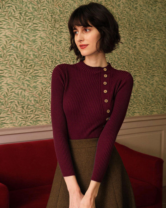 Women's knitted sweater with standing collar, ribbed texture, and button detail