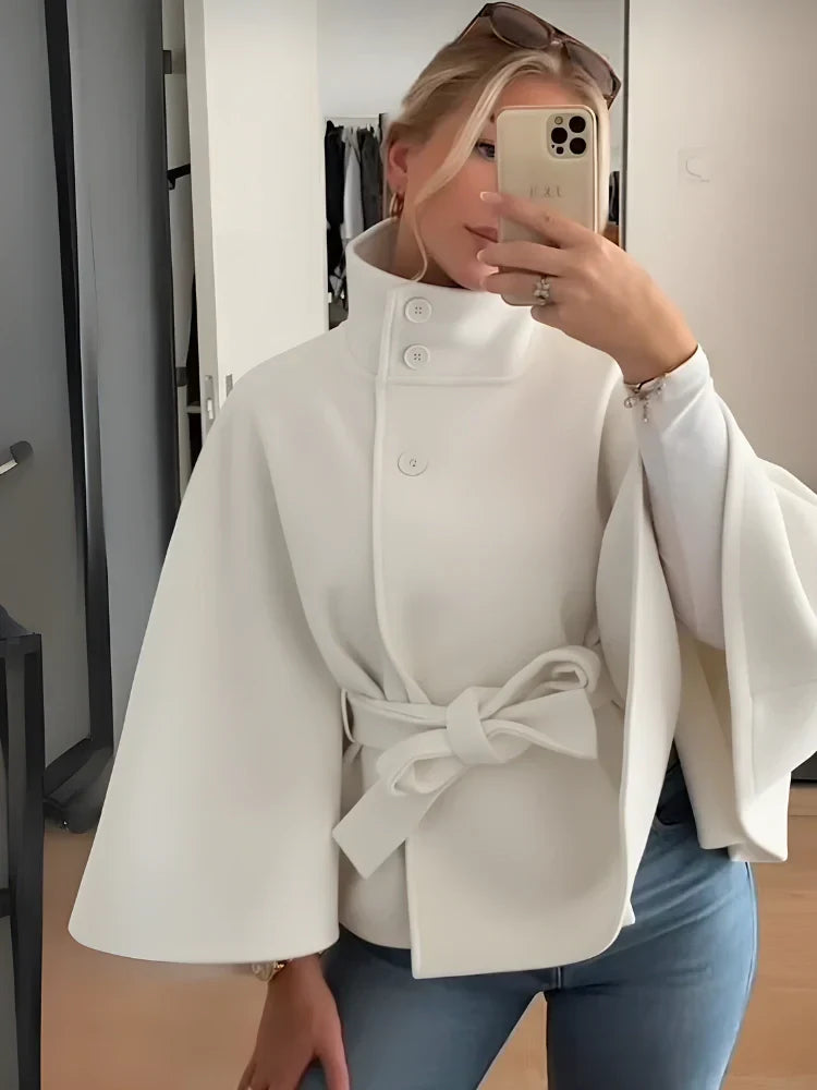 Women's cloak-coat for autumn with high collar, waist belt, and wide sleeves